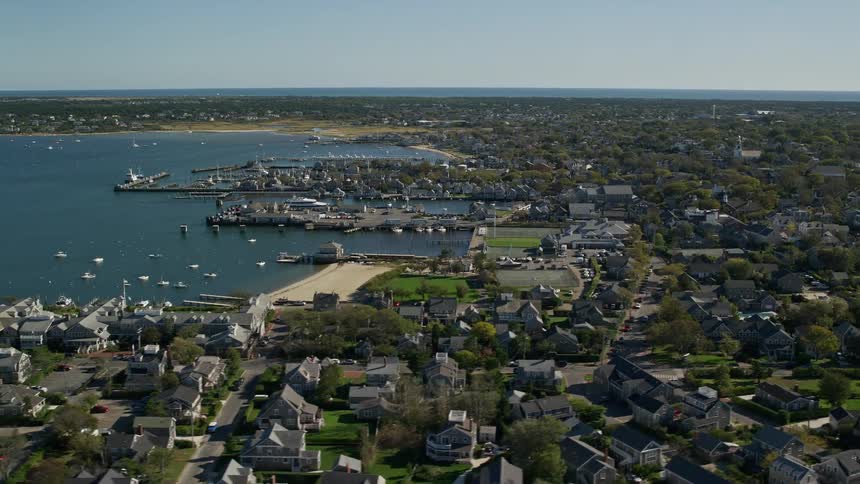 A city with small houses on the coast of a sea