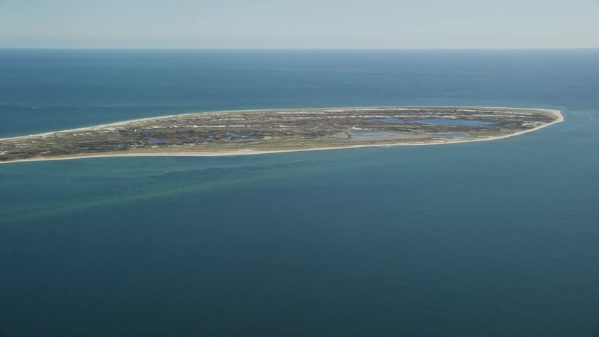 Aerial panorama of an island in a turquoise sea