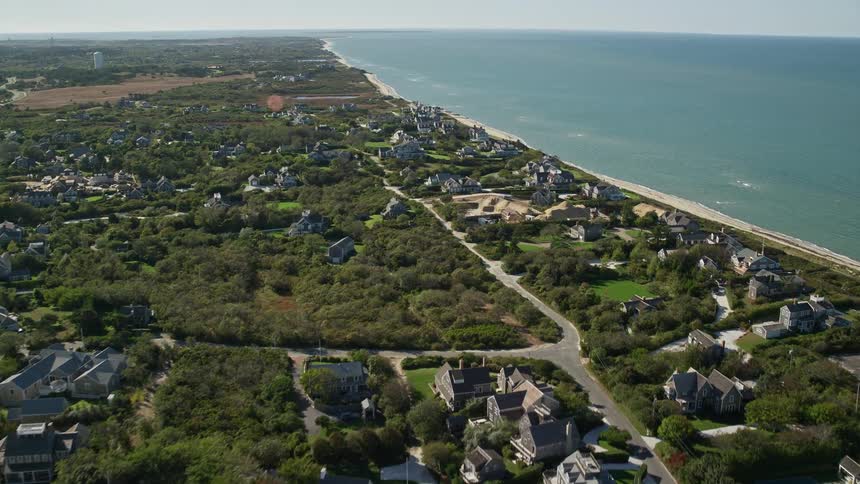 A suburban town next to the bay area as the buildings are surrounded by trees