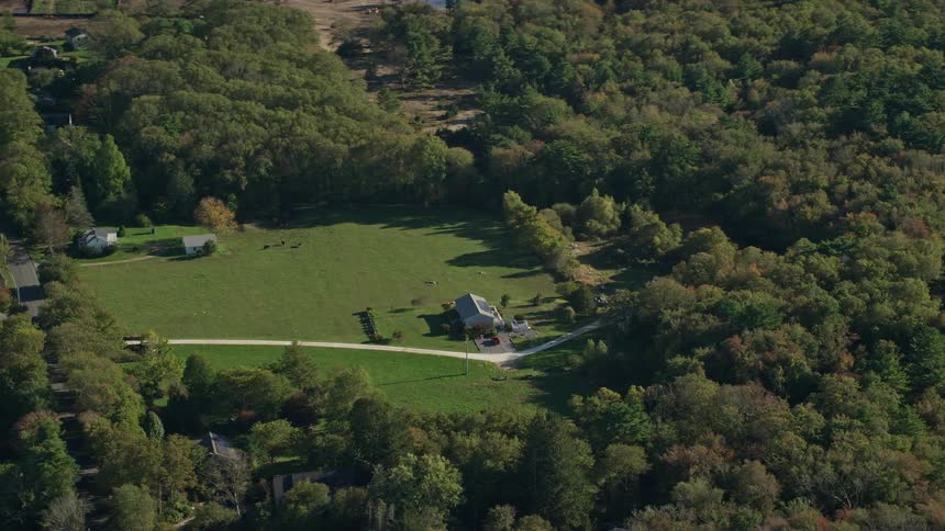 Aerial view of dartmouth massachusetts rural homes green lawns and encircling trees