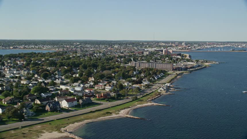 Aerial view of a small town next to a body of water