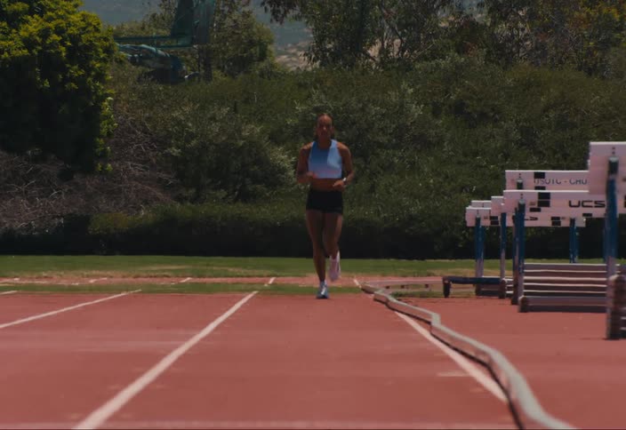 Woman running on a track