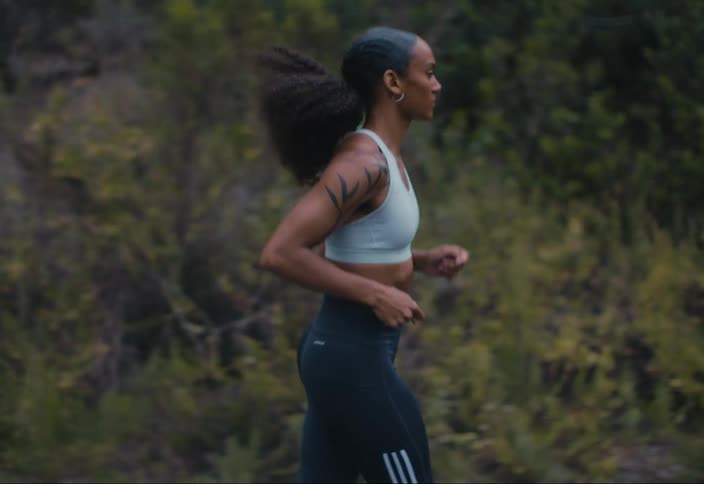 A woman is jogging outside
