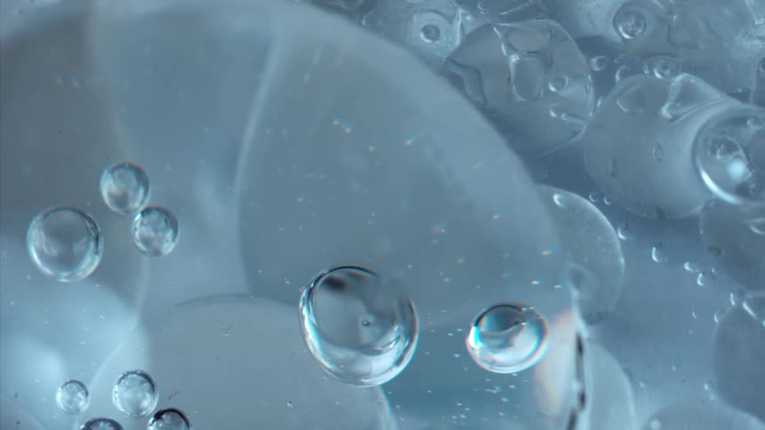 Bubbles flow through colorless liquid