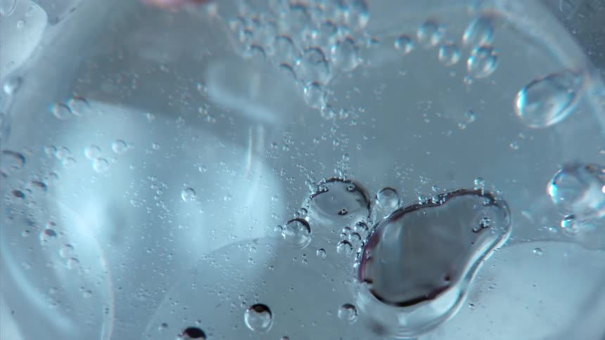 Bubbles float and move inside a clear sphere
