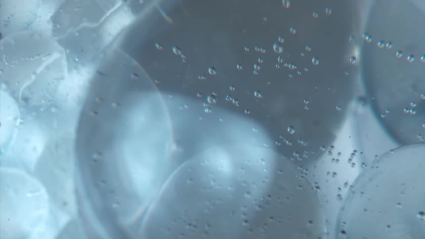 Bubbles and ice rotate through water