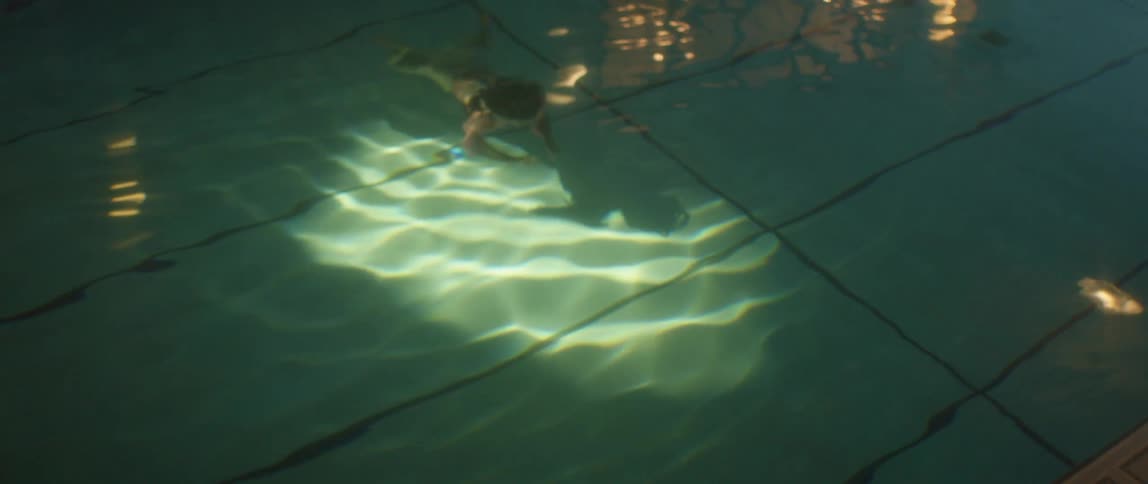 A woman swimming in a swimming pool