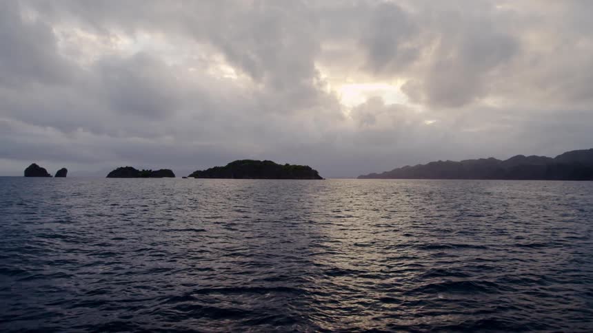Choppy ocean water under a cloudy sky