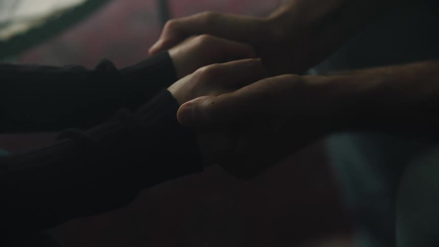 Two people are holding hands