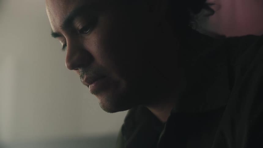 Close up of sad mans face looking down