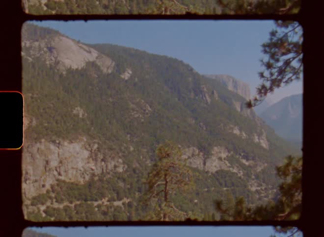 Landscape of mountains covered in grass on a sunny day