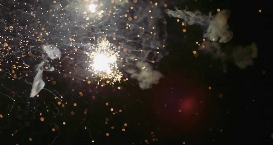 Several spark particles exploding in smaller versions on a black background