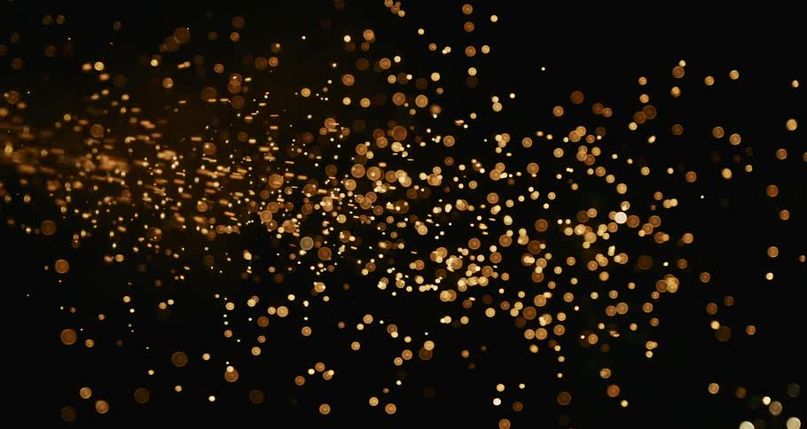 Multiple confetti and fireworks display in the sky at night