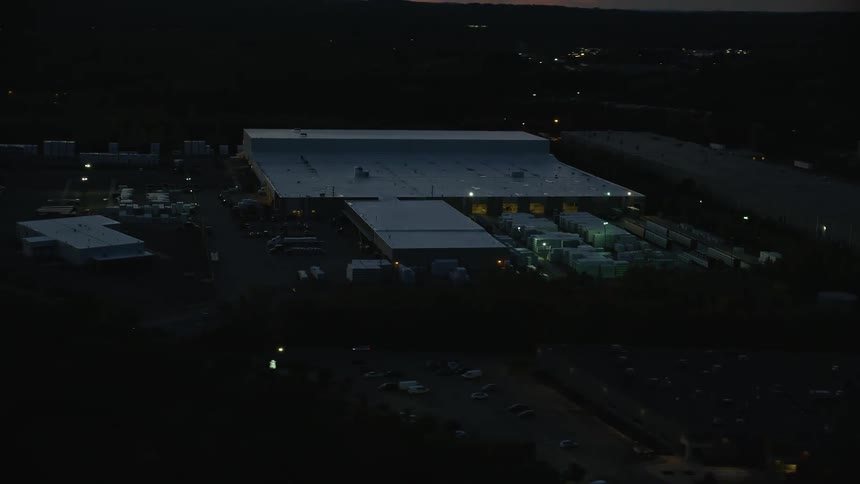 Aerial panorama of a fleet of vehicles and warehouses