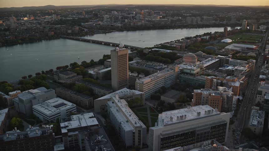 Aerial of an urban city with waterway at sunset