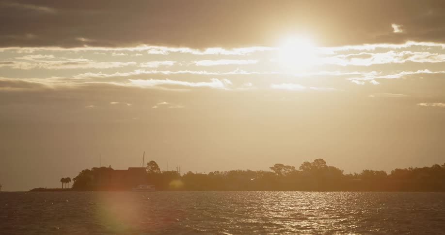 The sun is shining over the shore