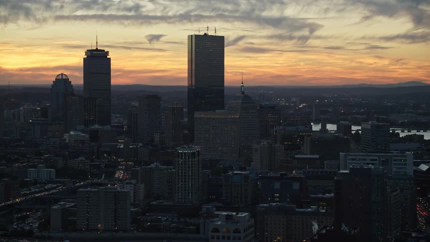 The sun is setting on the large city