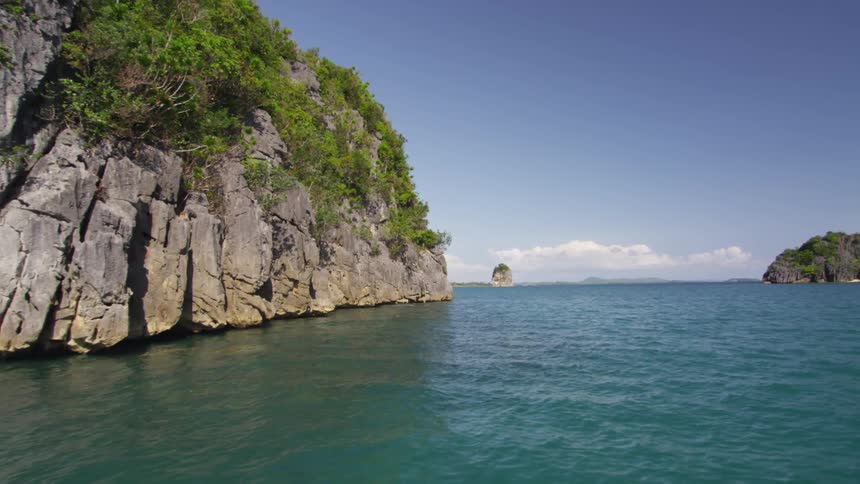 The cliff is surrounded by water