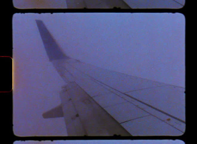 The plane is flying through the air