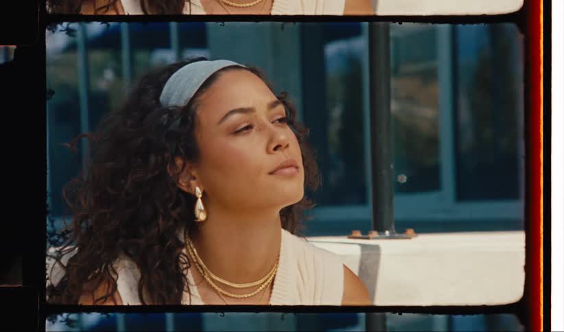 A woman is touching her hair