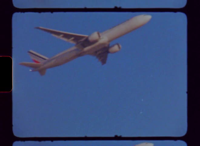 The plane is flying in the clear sky