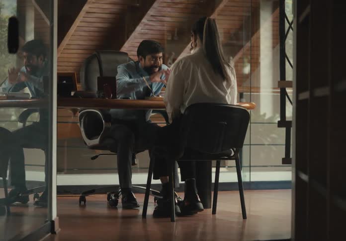 A man is screaming at an office worker