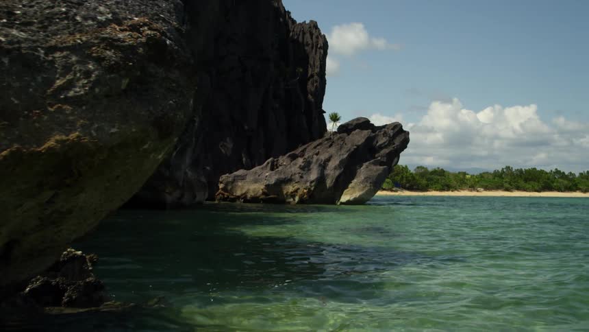 Rocks jut out into the calm water
