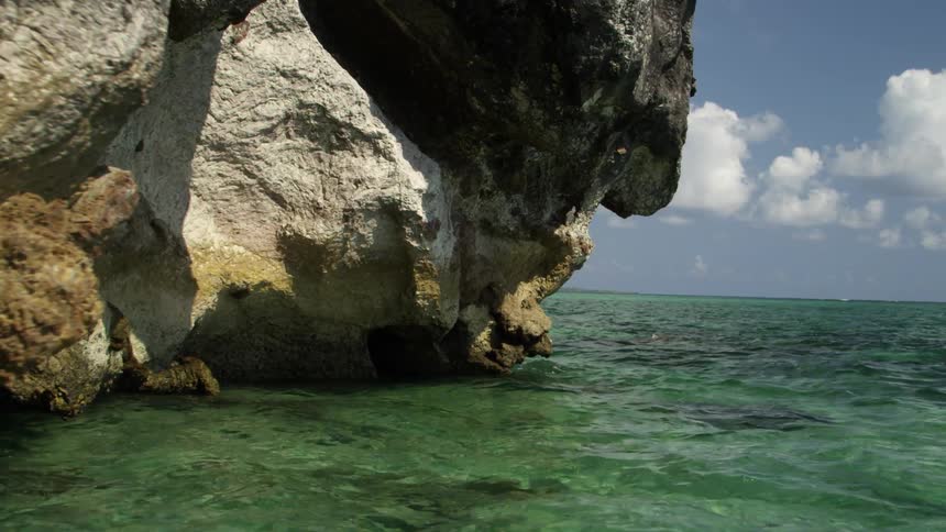 Clear waters below some large rocks