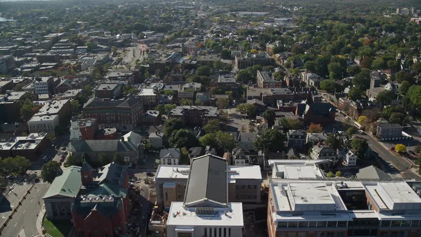 An aerial view of a city with a residential area full of trees