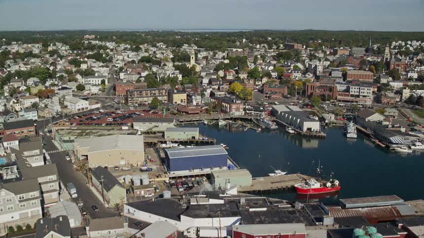 A small coastal town with a port full of boats