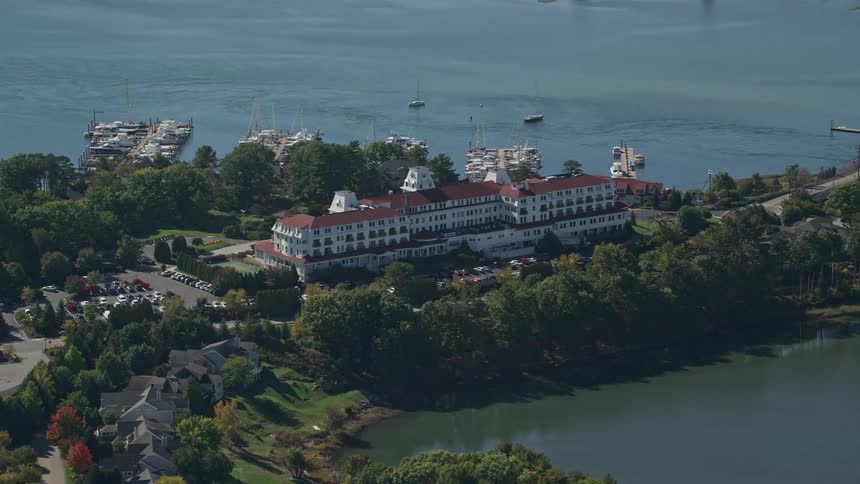 A large residential building facing a large river