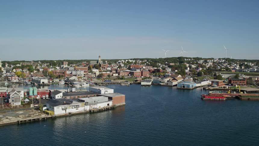 An aerial shot of the skyline of a smaller seaside city