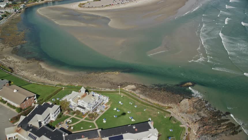 A helicopter flies over the shore