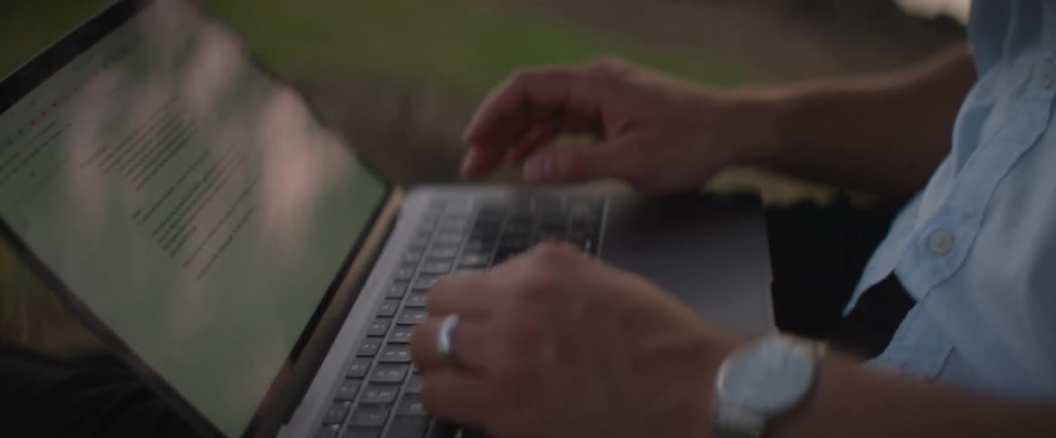 A man is typing on his keyboard