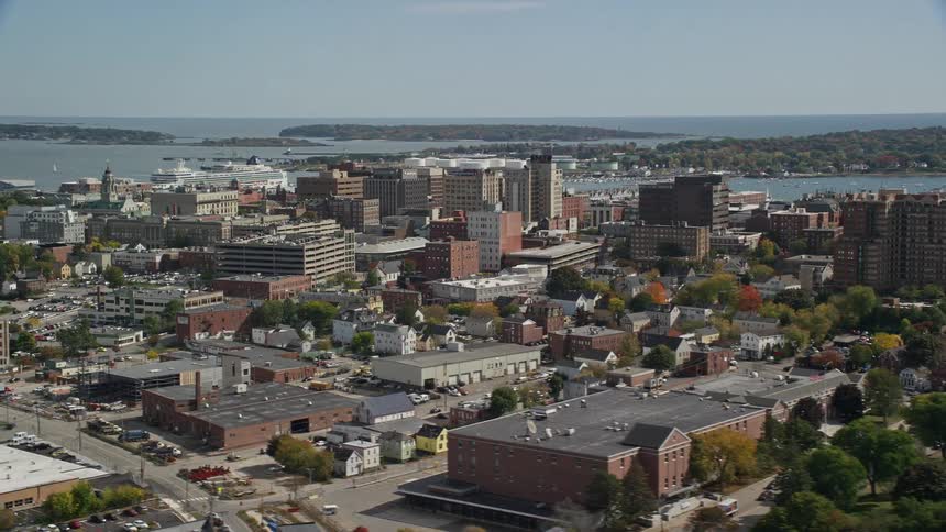 Aerial view of a parking lot and waterfront high rise buildings in the city