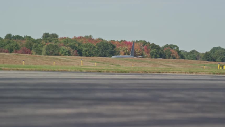 Commerical airplane landing on a runway