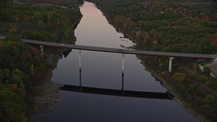 Aerial view of a bridge with vehicles passing