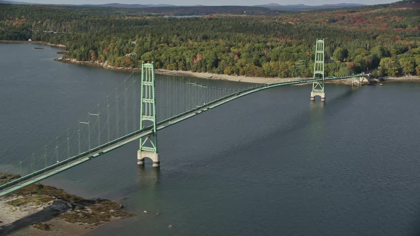Aerial of a bridge with arches over a river