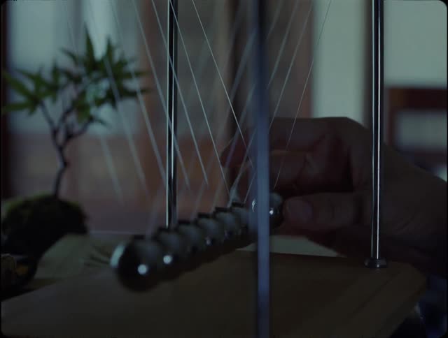 A person making a pendulum swing