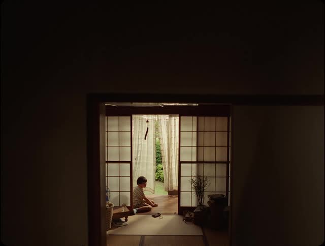 A child playing sitting on the floor at home