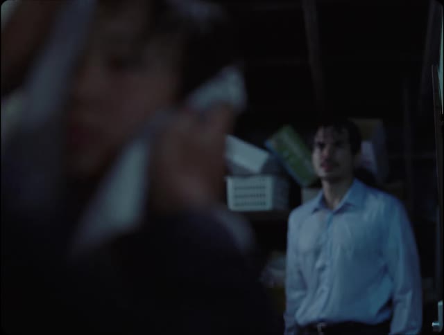 Person drying a boy with a wet man in the background