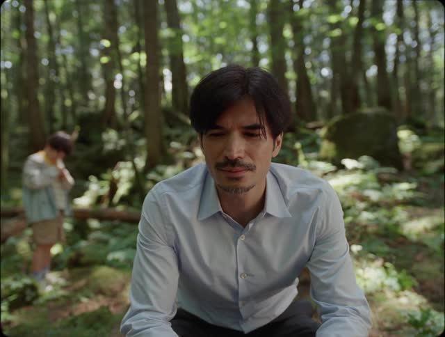 Man with his son in a forest