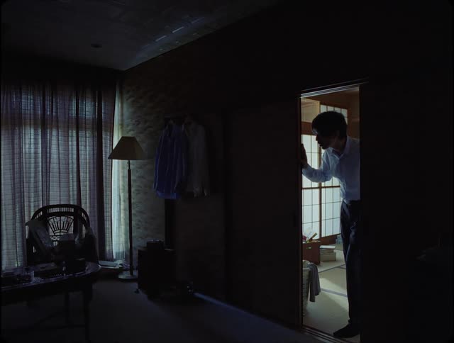 A man sneaks into the room