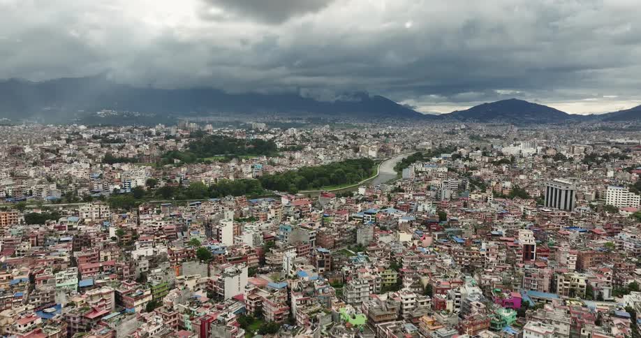 Aerial view of apartments and buildings in the city with a river