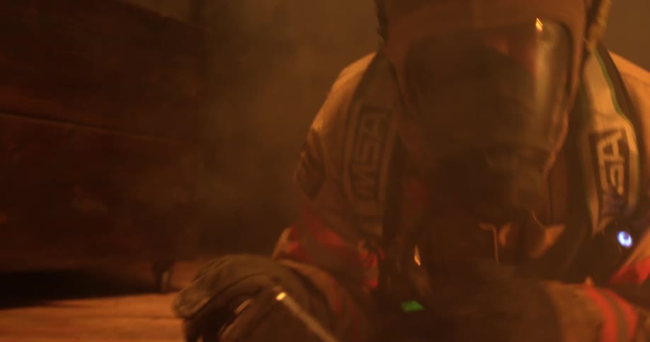 A firefighter is crawling through a burning home