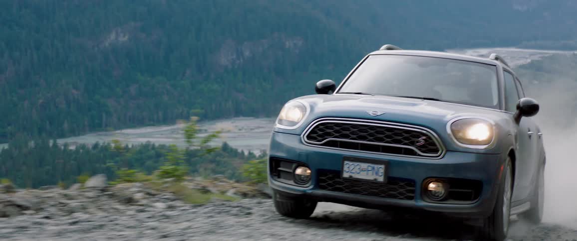 The vehicle is driving off road by the river