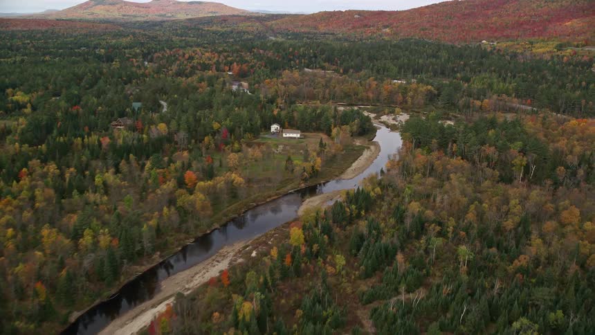 Skyline of a rural town with rivers and forest during the day