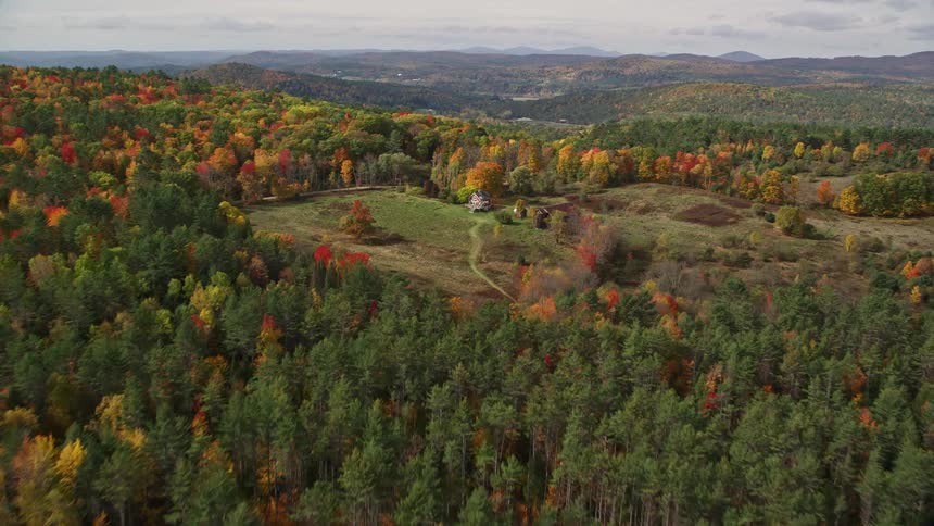 A barn is on the ranch in the woods