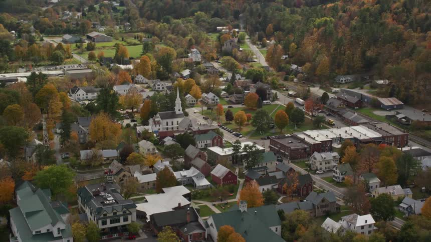 Aerial of a small town in autumn with a courtyard in the center of town