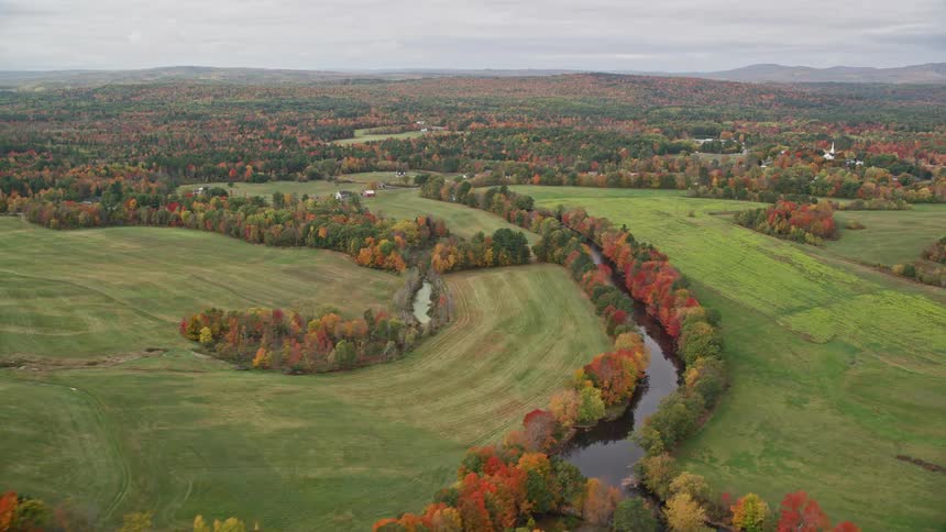 Aerial view of fields in the countryside next to a small rural town